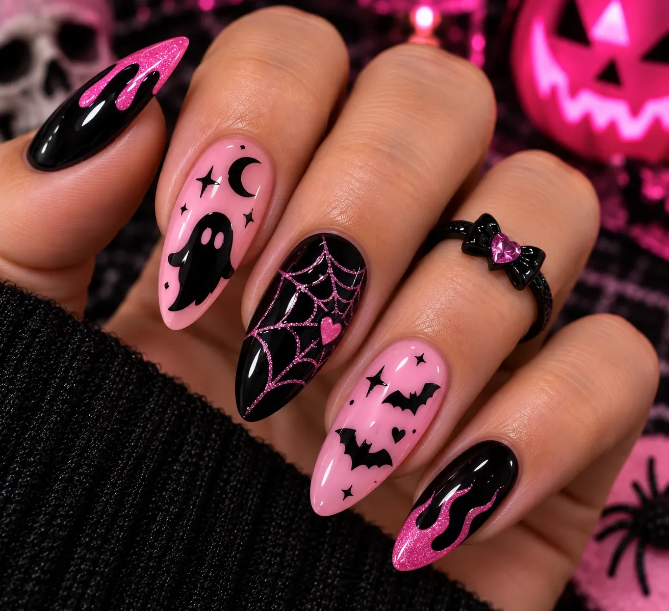 Pink and black Halloween nails with spooky details