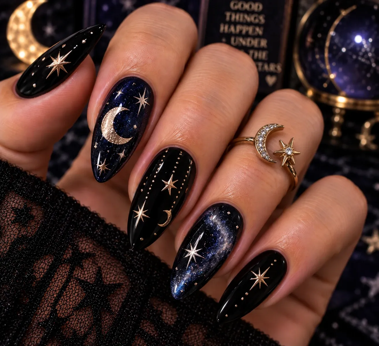 Midnight celestial Halloween nails with moons and stars