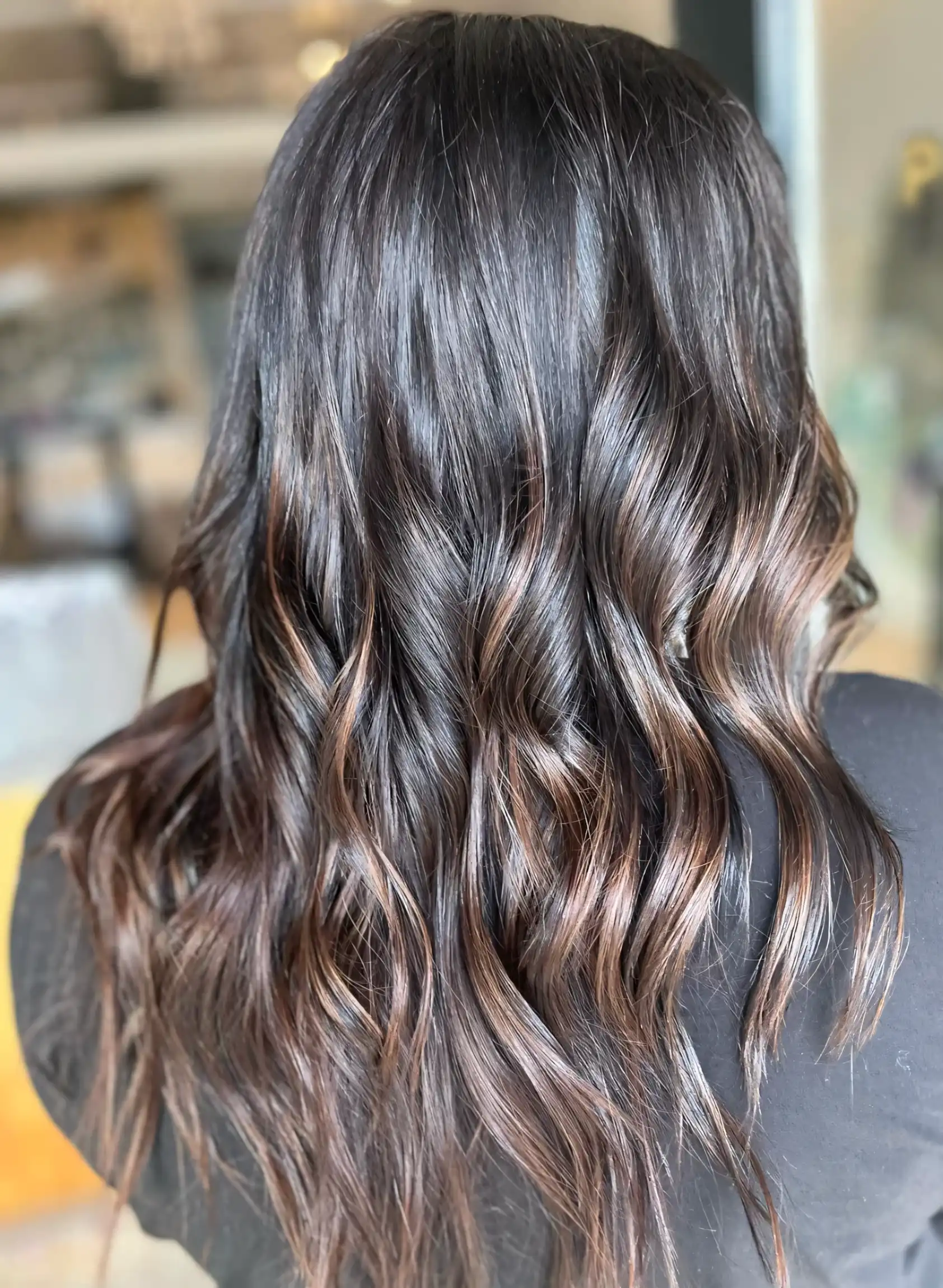 Dark brunette waves with soft chocolate brown ribbon highlights