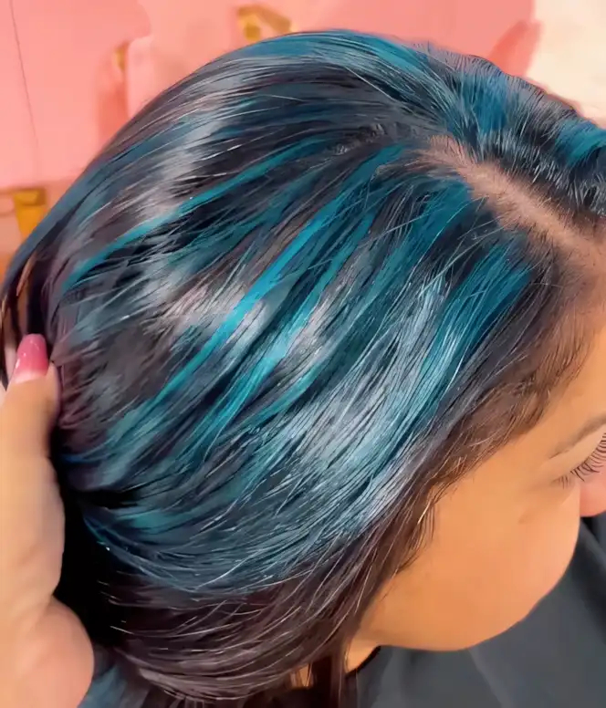 Black straight hair with vivid deep teal sections