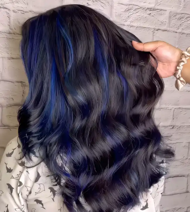 Dark brown long wavy hair with midnight blue highlights