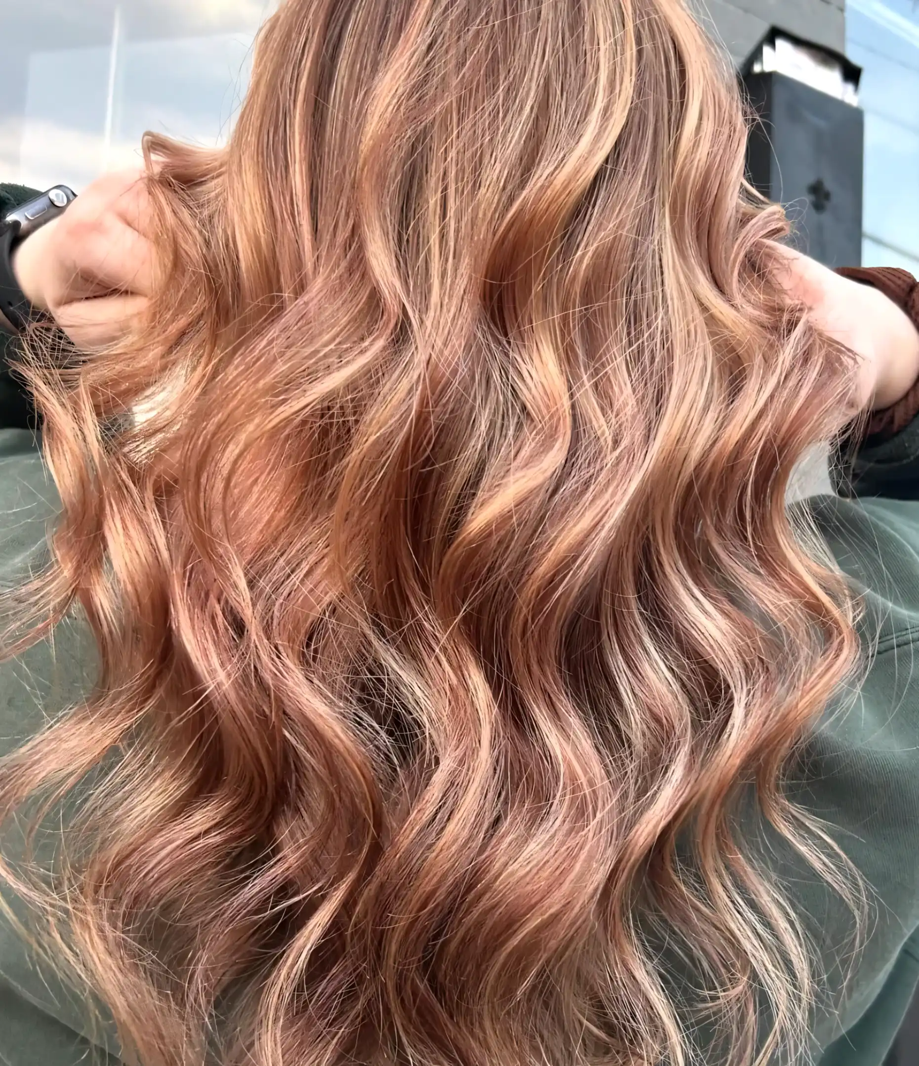 Long wavy light brown blonde hair with rose gold ribbon highlights