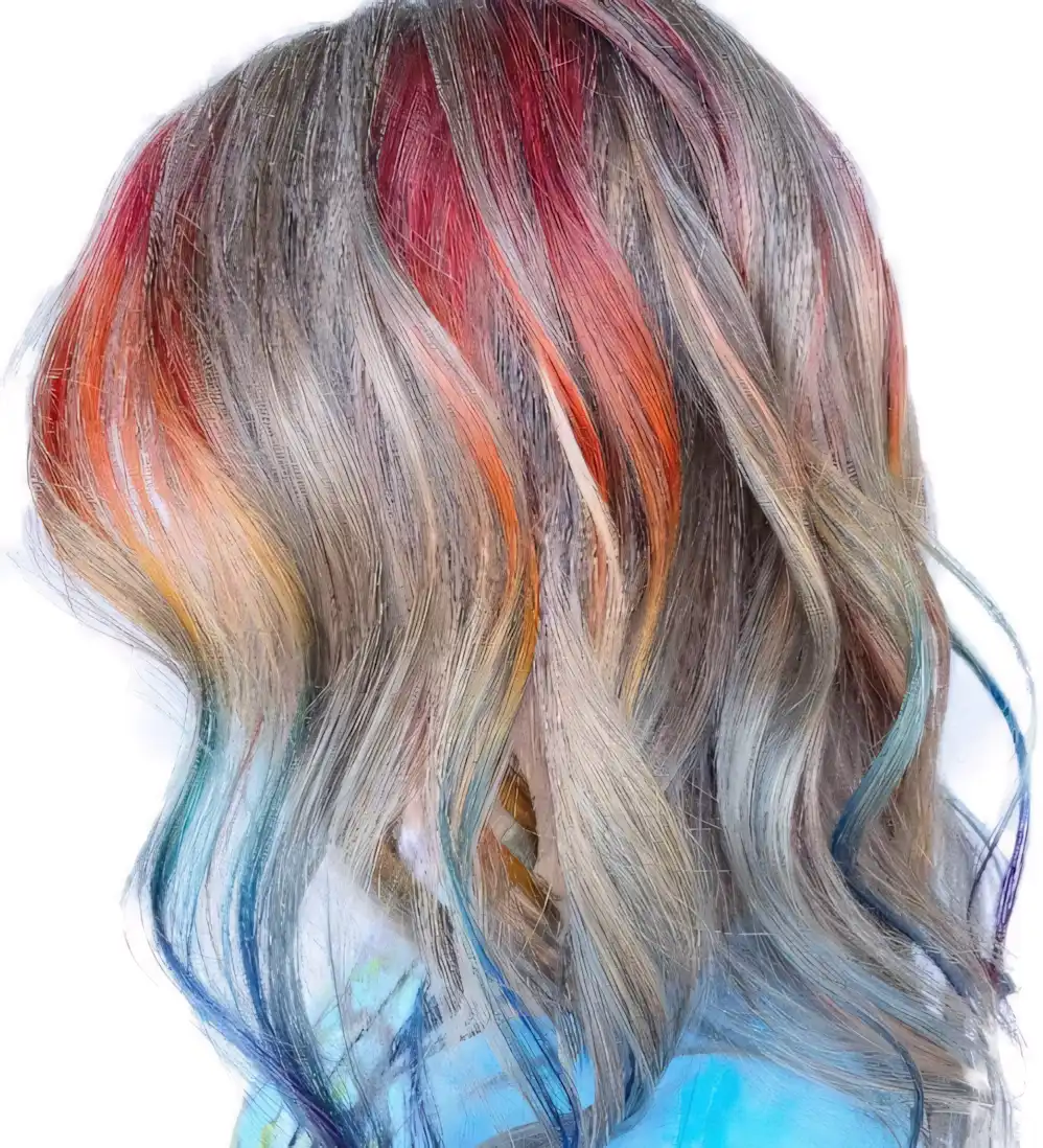 Light gray blonde wavy hair with rainbow streaks and colored ends