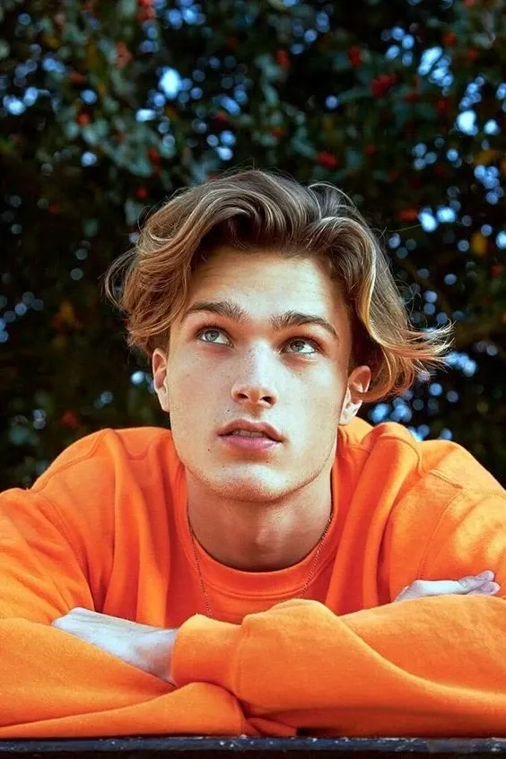 Men's curtain hairstyle with a center part