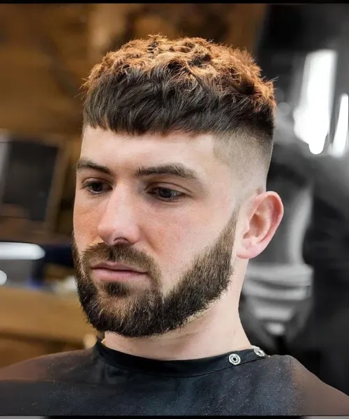Men's short fringe haircut with textured bangs