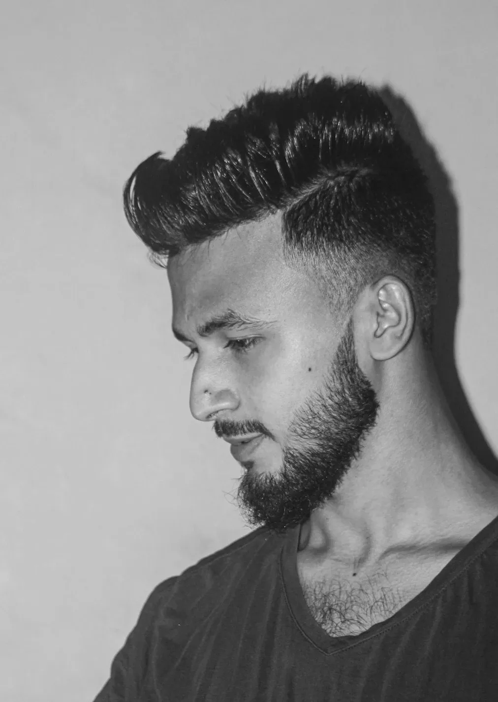 Men's modern side-part hairstyle with neatly styled hair